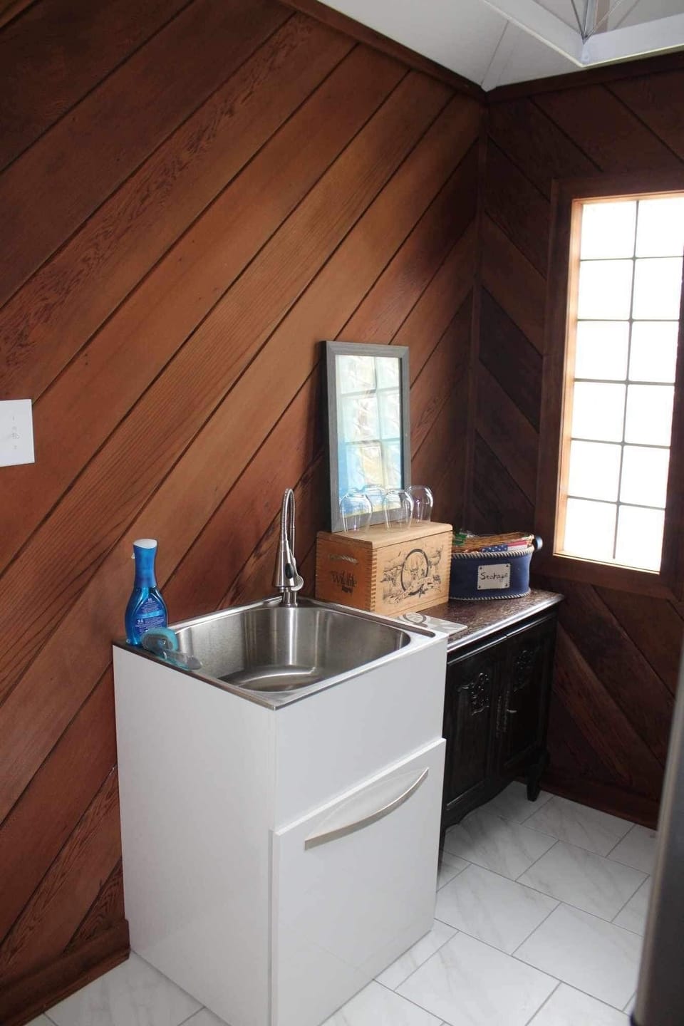 Guesthouse kitchenette with sink, wine glasses, Keurig and frig.