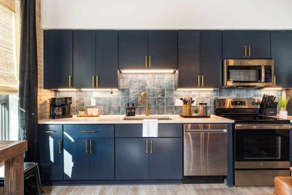 Every inch of this navy kitchen is designed for both beauty and function.