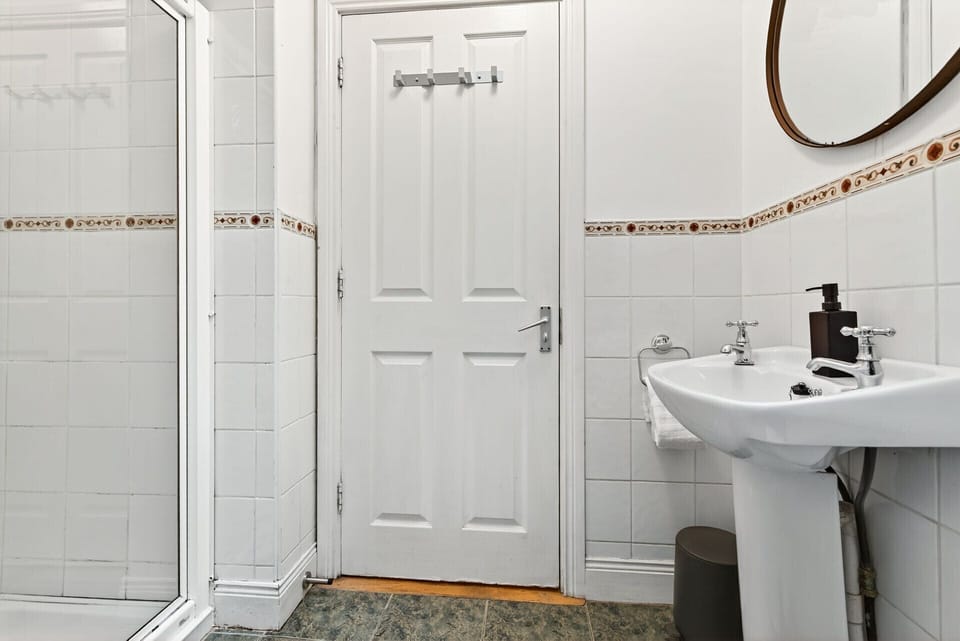 Large bathroom with electric shower