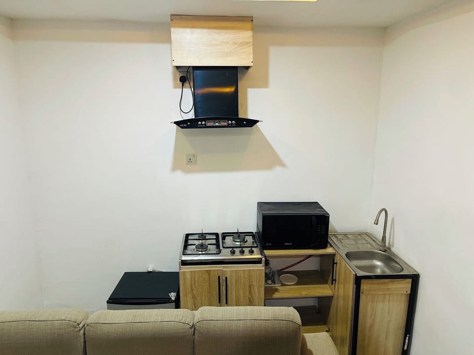 Superior Apartment, City View | Private kitchen | Mini-fridge