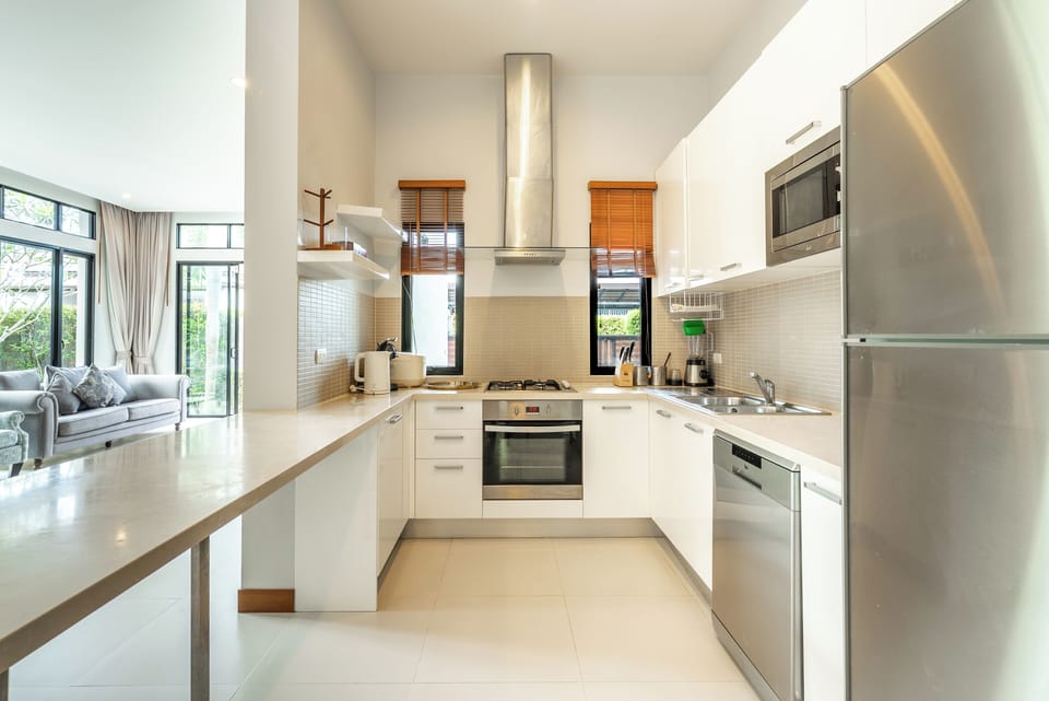 Family Villa | Private kitchen | Electric kettle, dining tables