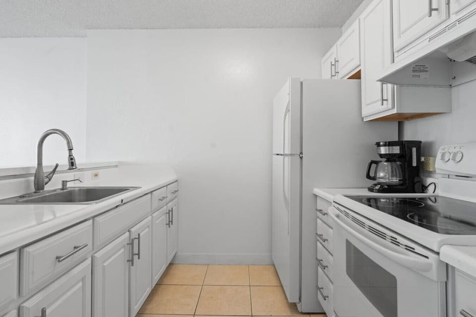 The kitchen is equipped with all the essentials, from pots and pans to a drip coffee maker.