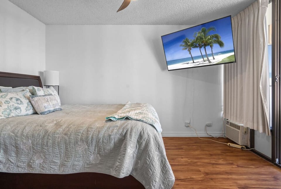 Wake up to comfort and coastal Get a restful night’s sleep on this plush queen bed while staying cool with the room`s ceiling fan and air conditioner. this serene bedroom is your family’s peaceful retreat after a day of adventure