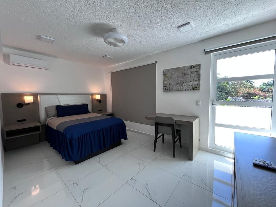 Standard Room, 1 Queen Bed, Balcony, Pool View | Laptop workspace, blackout drapes, iron/ironing board, free WiFi