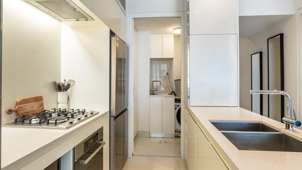 Experience the convenience of a fully equipped kitchen featuring sleek stainless steel appliances and thoughtful touches that make self-catering a breeze.