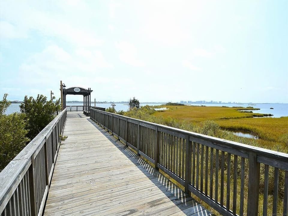 Stroll along the scenic boardwalk where tranquil marsh views and nature trails provide an idyllic escape in this family-friendly resort.