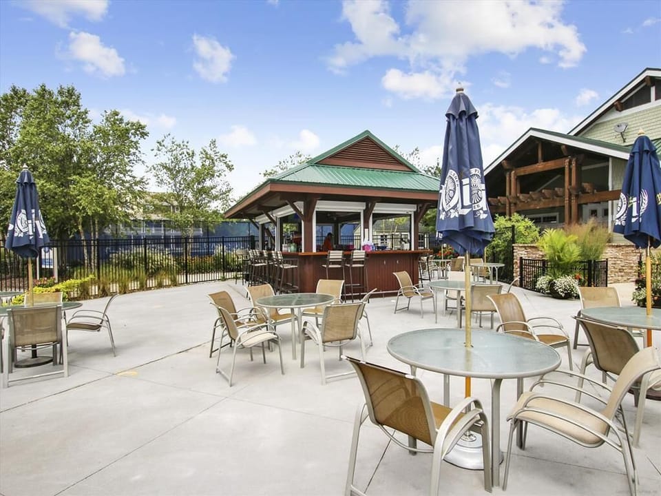 Experience ultimate relaxation at this luxurious resort near Fenwick Island, Delaware, featuring inviting outdoor amenities, nature trails for exploration, a vibrant clubhouse, and family-friendly leisure options for all ages.