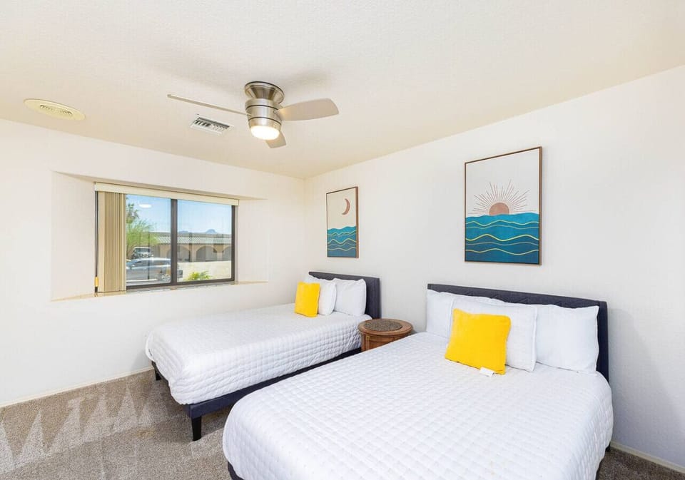 Two full beds and a mirrored closet make this room perfect for extra guests or travel companions.