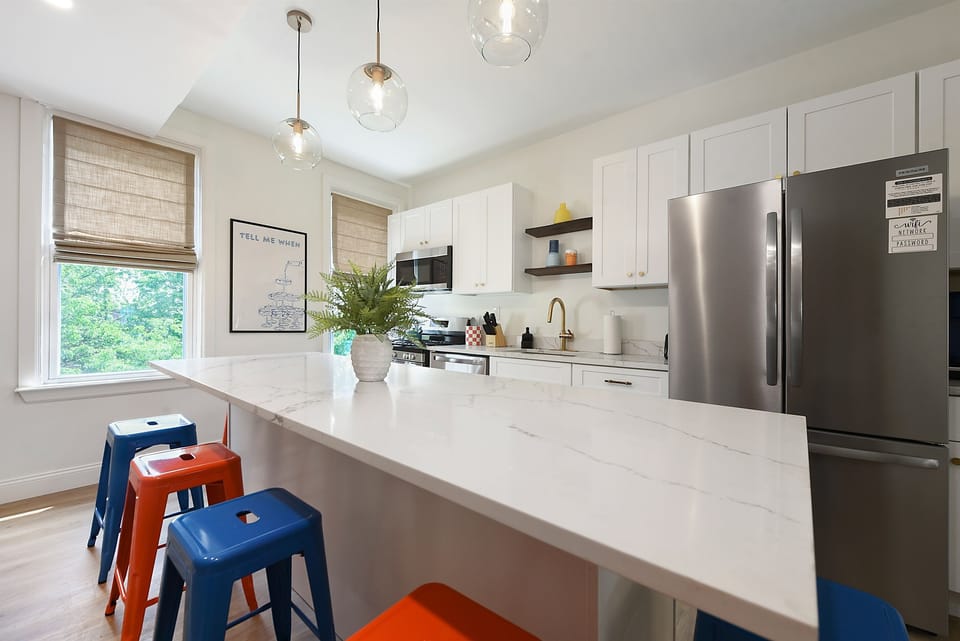 Pull up a (colorful) seat—plenty of room around the counter for snacks, laughs, and late-night chats