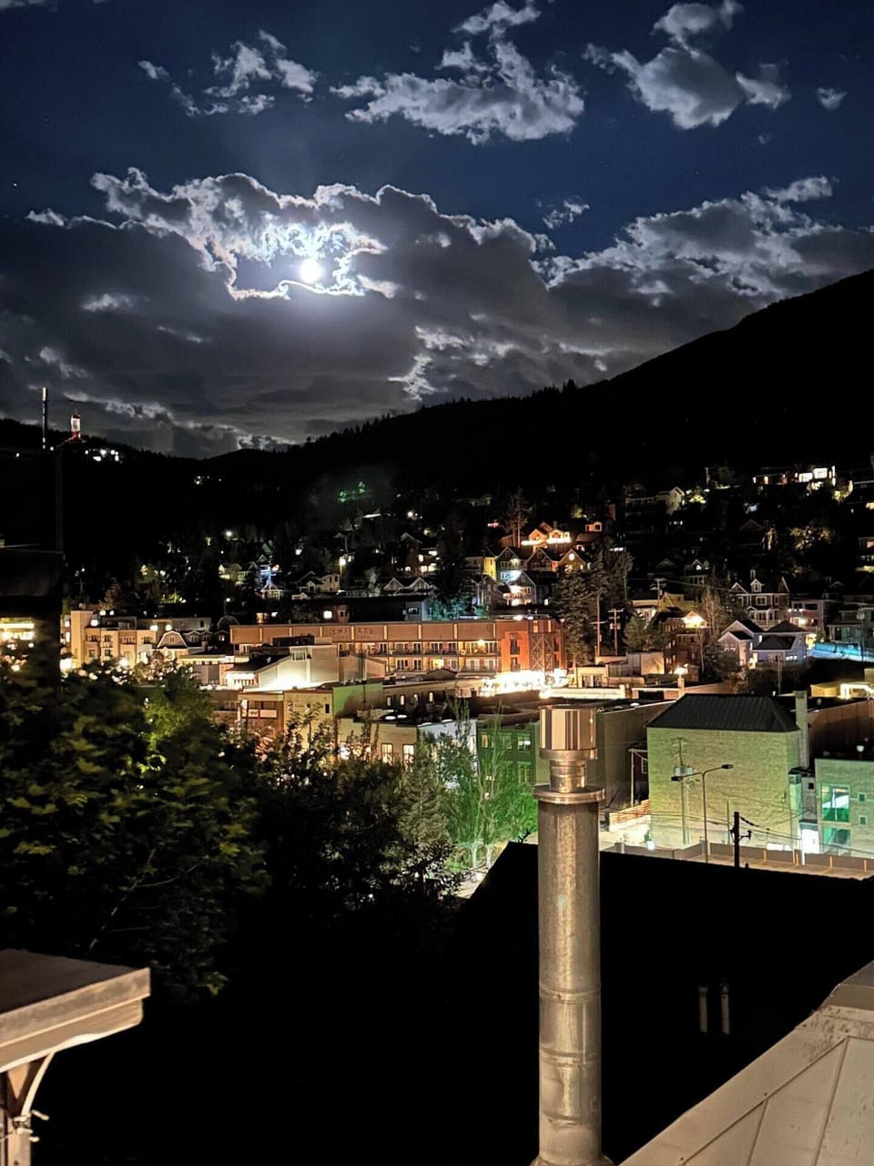 - Park City nightlife sparkles under a glowing mountain moon  
- Cozy streets and warm lights create a magical alpine evening  
- Relax after a day on the slopes with incredible night scenery