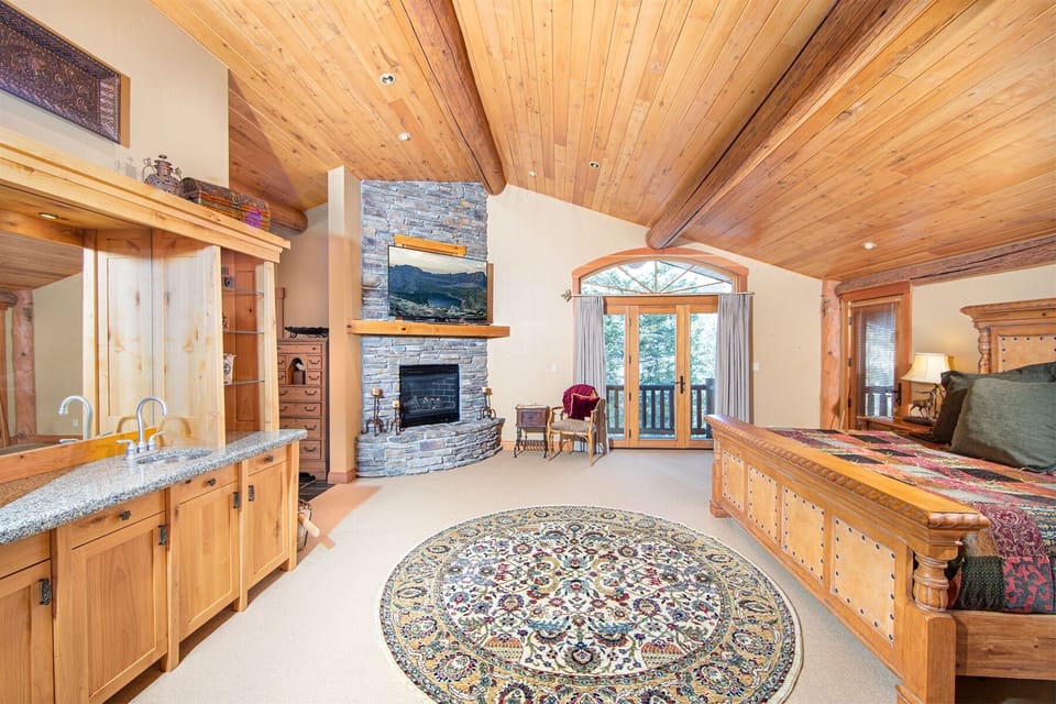 The master suite offers private gas fireplace, kitchenette, 2 patios, walking closet & beautiful ensuite | Main Level
