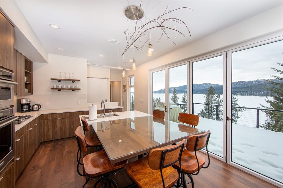 The dining area features custom wood table and hightop seating | Main Floor