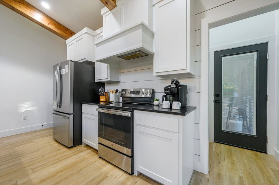 Start your mornings right with fresh coffee, warm light, and a kitchen that’s as functional as it is beautiful.