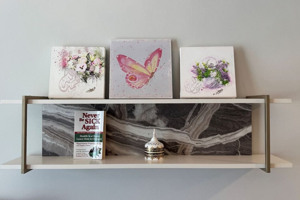 A charming shelf adorned with mini canvas paintings, adding a touch of artistry to the space.