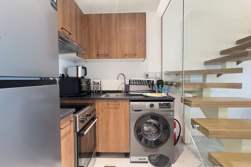 Fully equipped kitchen with modern appliances and essentials