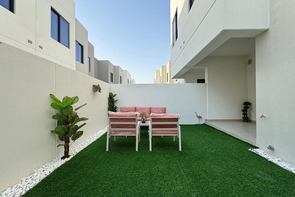 A beautifully landscaped front yard with lush greenery and colorful flowers, creating a welcoming and inviting first impression.