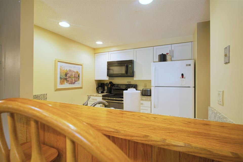 Full Kitchen with Serving Bar in Resort Condo