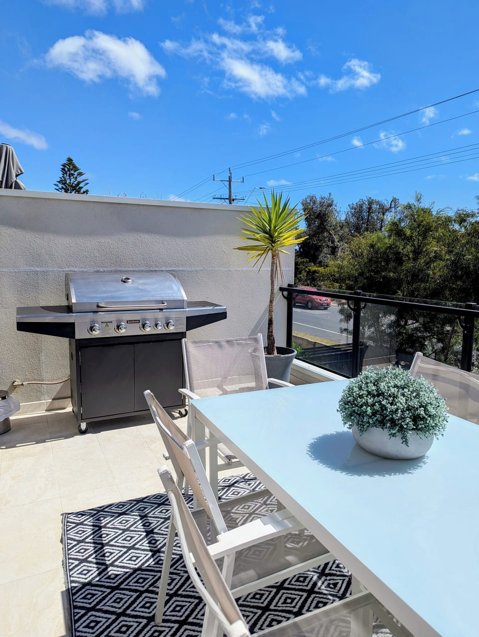Deck with dining table and bbq