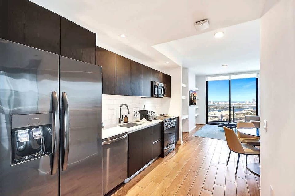 Dark-cabinet kitchen with full appliance suite