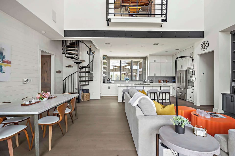 Open-concept layout connects the living, dining, and kitchen areas ideal for gathering with family and friends.