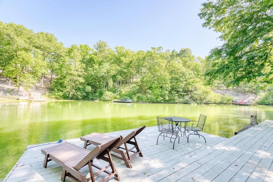 Private dock with lounge chairs – relax by the water with unobstructed lake views.