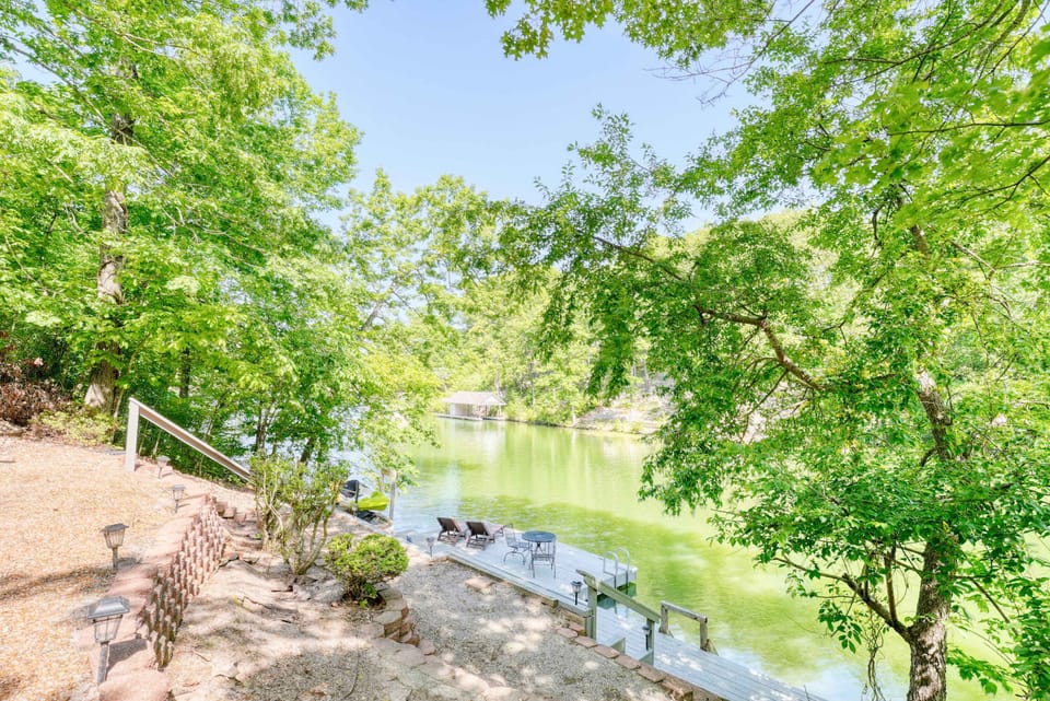 Aerial view of multi-level outdoor terraces leading to the private dock—your lakeside oasis.