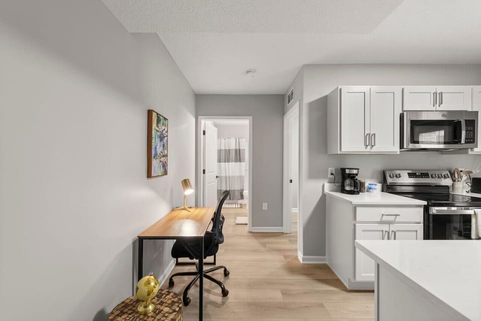 Dedicated workspace with a comfortable desk, ergonomic chair, and task lighting.