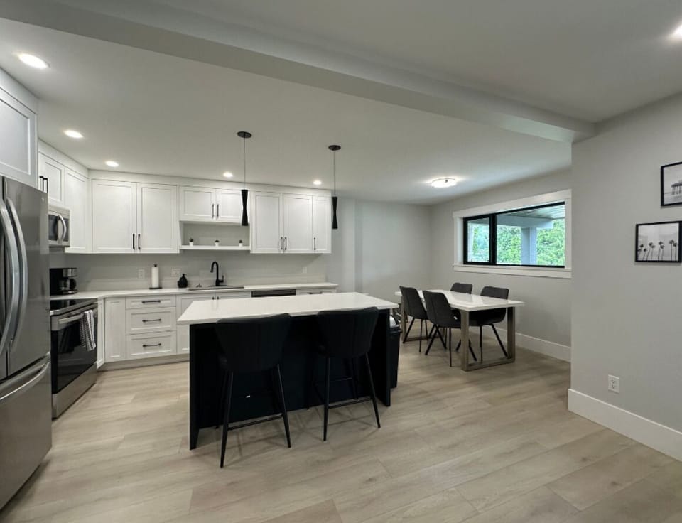 Cook and connect in this open-concept kitchen and dining space with a large island, full-size appliances, and seating for the whole group.
