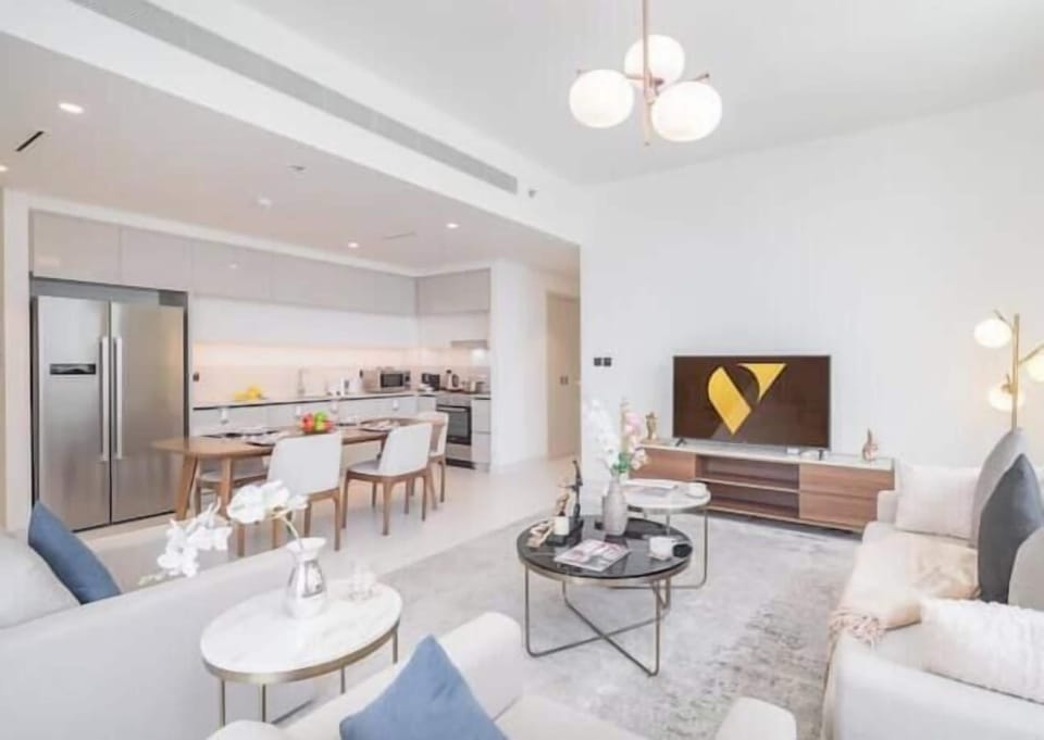 Luxury Apartment, Beach View | Living area | 65-inch Smart TV with satellite channels