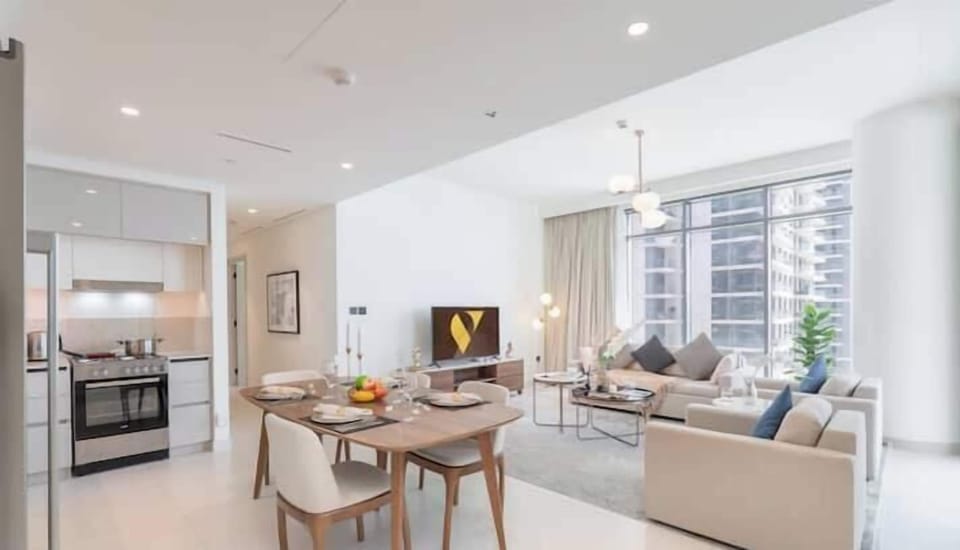 Luxury Apartment, Beach View | Living area | 65-inch Smart TV with satellite channels