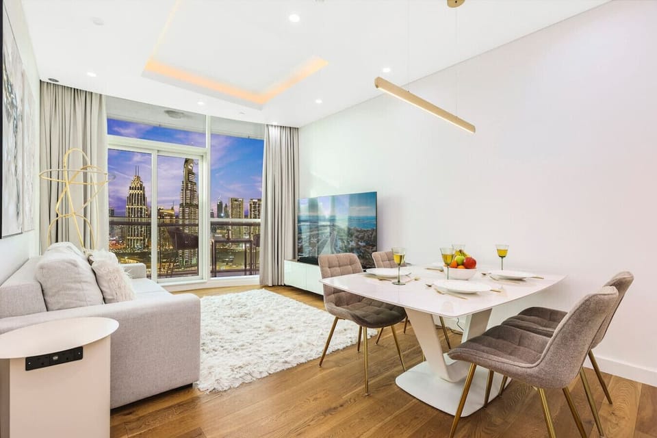 Living Room: Stunning skyline views from stylish seating—perfect for relaxation and entertainment!