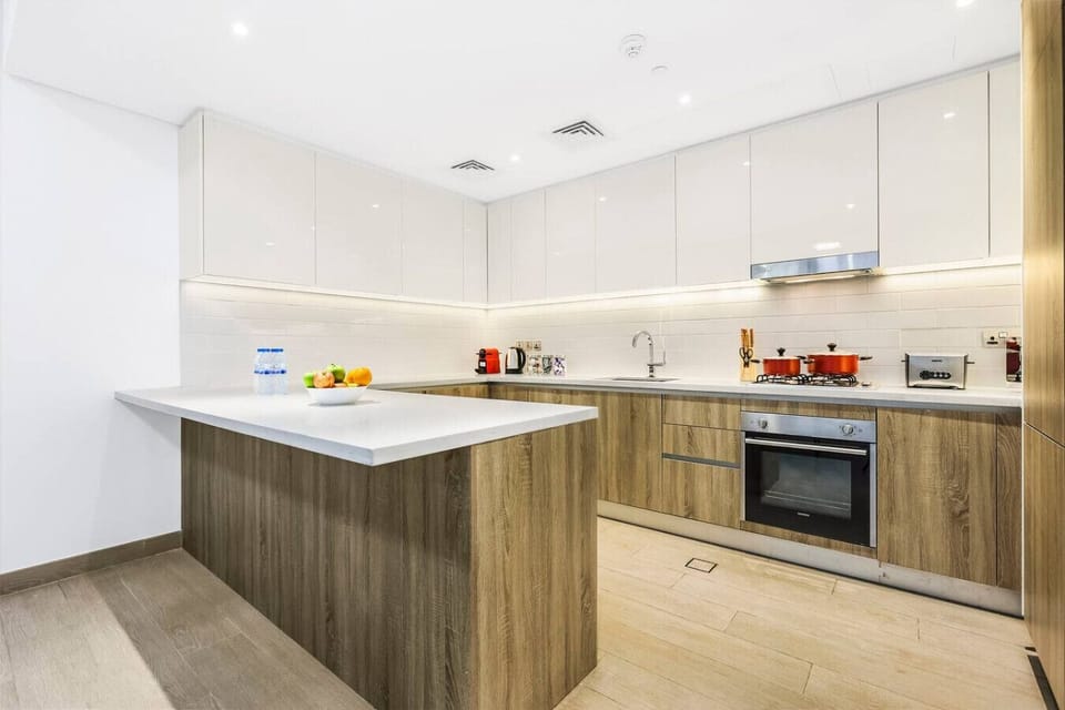 Gourmet Kitchen: Enjoy a sleek design with modern appliances and ample counter space for cooking!