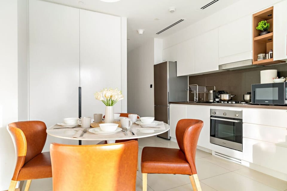 Dining Area: Bright and inviting space for unforgettable meals with a chic design and modern appliances!