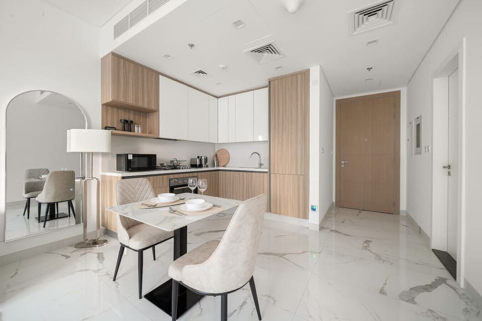 Kitchen/Dining Area: Modern elegance awaits with a chic dining setup and stylish kitchen amenities!