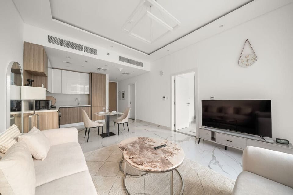 Living Room: Modern elegance awaits! Unwind in style with chic decor and vibrant natural light.