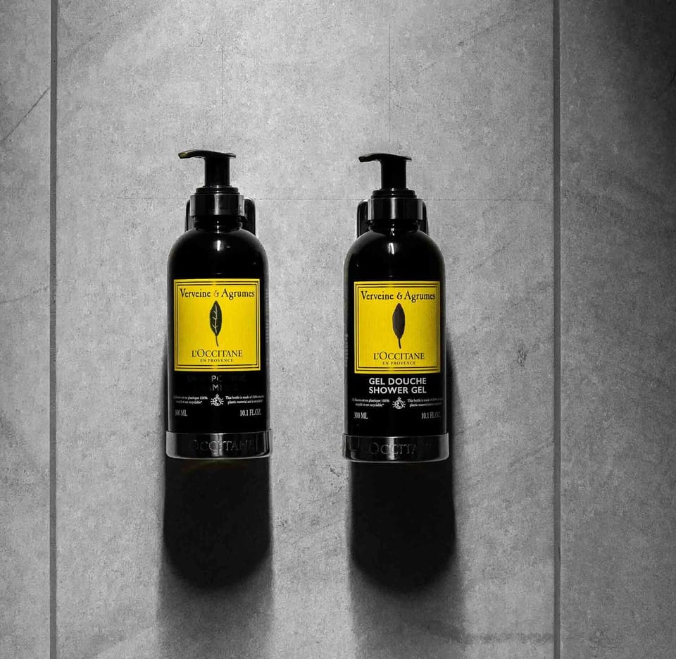 Shower, hair dryer, slippers, towels