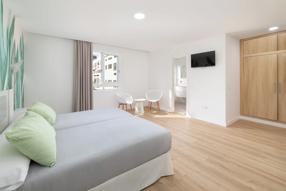 Standard Twin Room, City View | Laptop workspace, blackout drapes, free WiFi, bed sheets