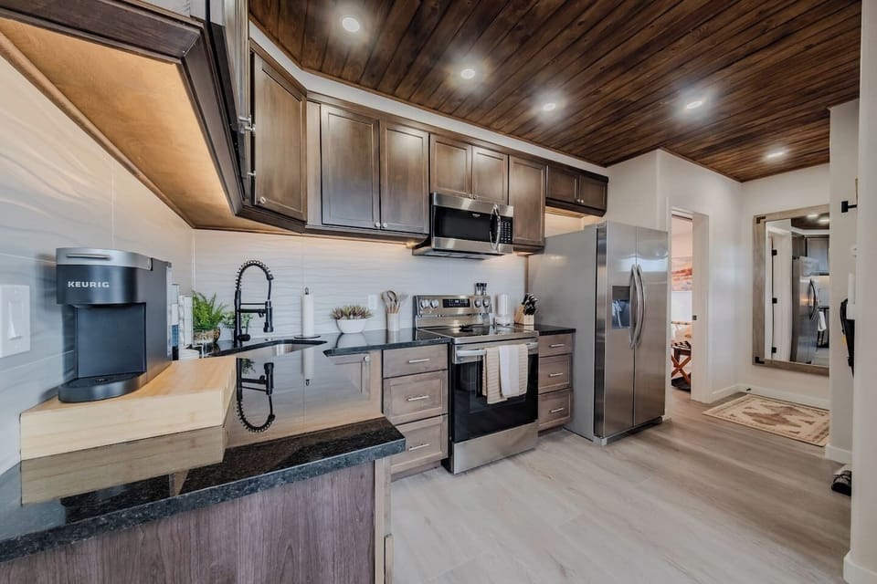 Spacious modern kitchen with stainless steel appliances and plenty of counter space.