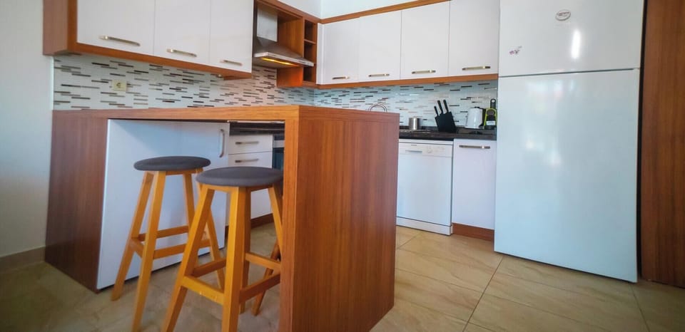 Sweet Home Apartments B | Private kitchenette | Fridge, stovetop, coffee/tea maker, electric kettle
