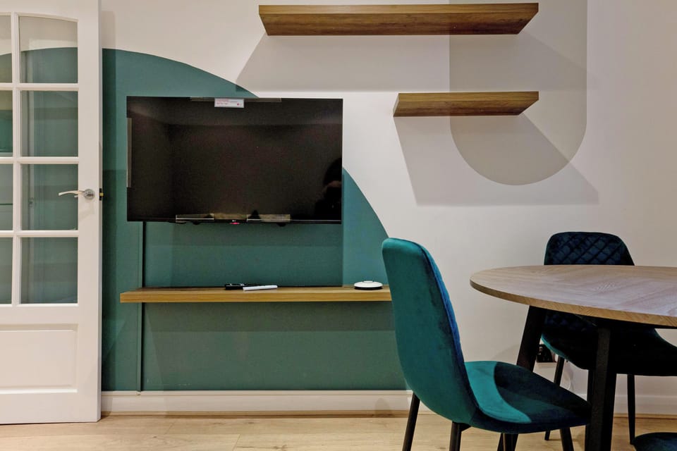 Apartment, City View | Living area | Flat-screen TV