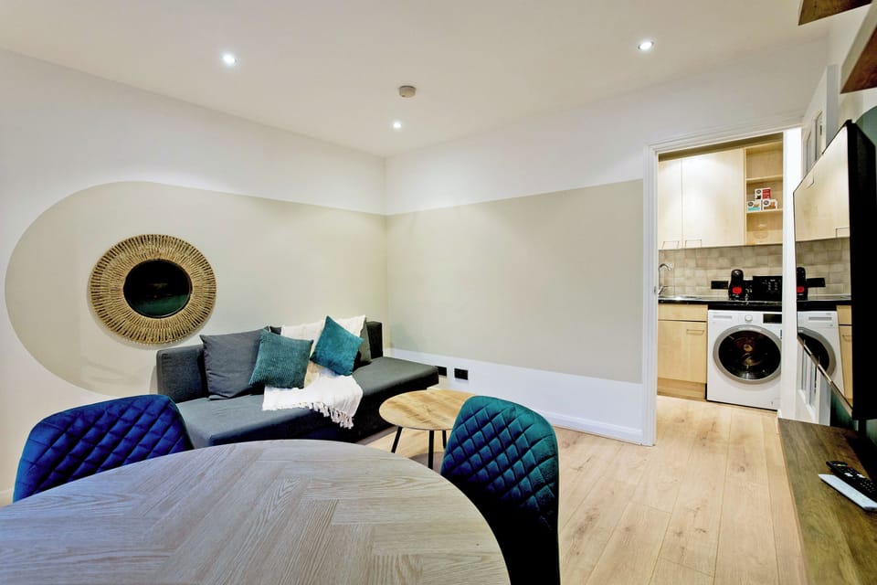 Apartment, City View | Living area | Flat-screen TV