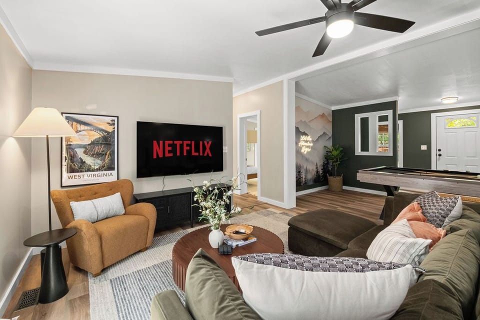 Game night ready with a pool table, and 65” Roku TV.