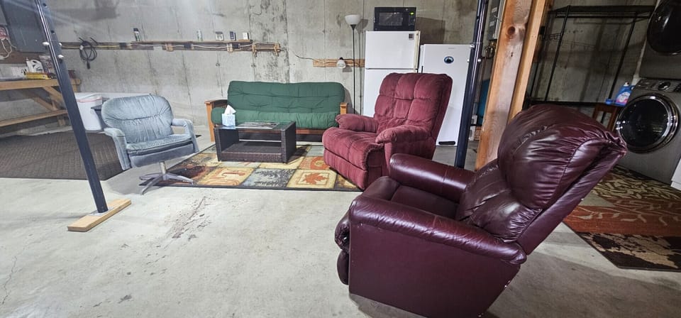 Separate-entry basement with comfy seating and game night vibes.
