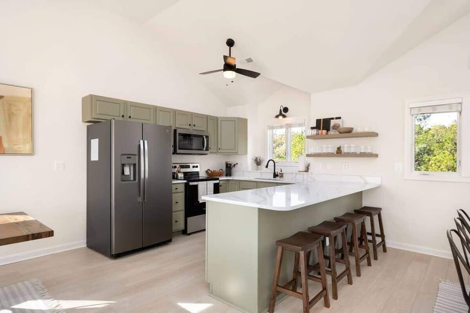 Prepare culinary masterpieces in style at Yellow Lotus's fully equipped kitchen, complete with modern appliances, sleek quartz countertops, and convenient bar seating. Elevate your cooking experience in this culinary haven!  #YellowLotus #FullyEq