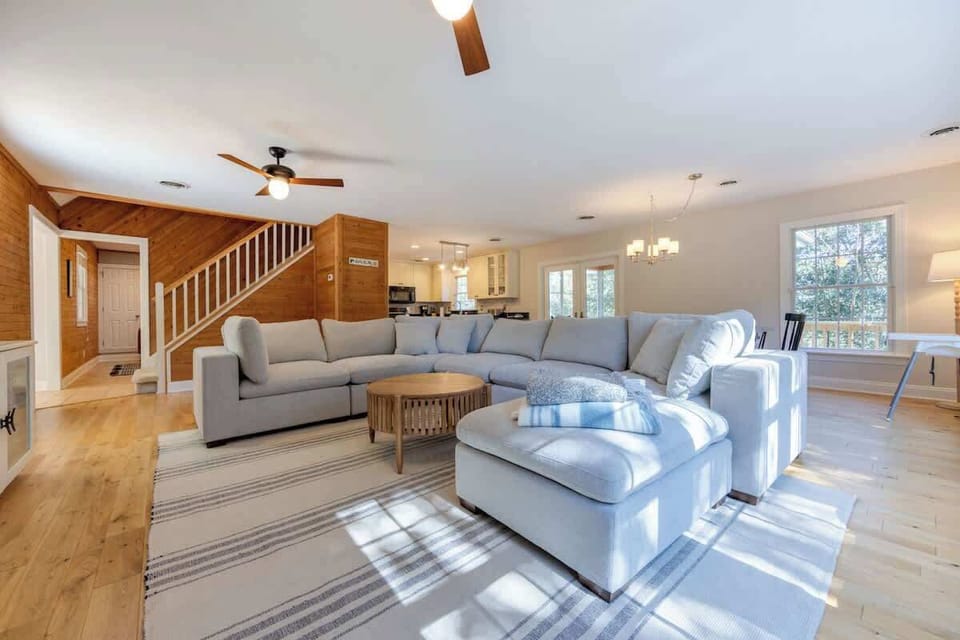 Entertain in style in this open and airy living room with dining space for 10! ✨ Enjoy gourmet meals prepared in the fully updated kitchen, equipped with all the amenities you need. Your perfect gathering space awaits! #HomeEntertaining #OpenConcept
