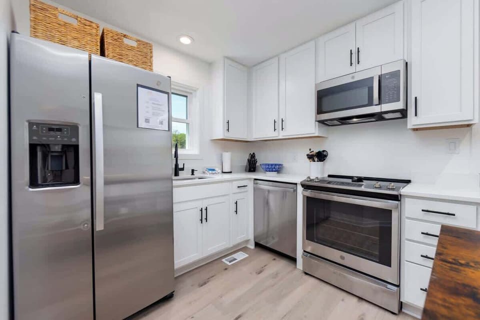 Step inside to discover a freshly updated interior boasting brand new floors and a modern kitchen, perfect for whipping up delicious meals after a day in the sun. Enjoy leisurely mornings and tranquil evenings on the screened porch.
