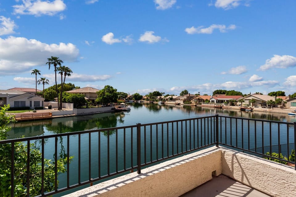 Take in panoramic views of the shimmering lake and mountains from your private second-story balcony—the perfect spot for morning coffee.