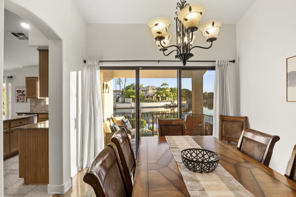 Enjoy elegant group dinners in this light-filled formal dining room featuring direct access to the scenic waterfront patio.