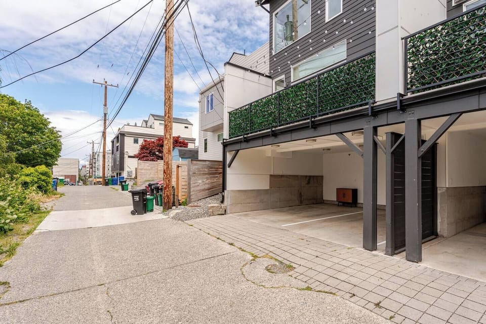 Private entry from a quiet residential alley behind the home.