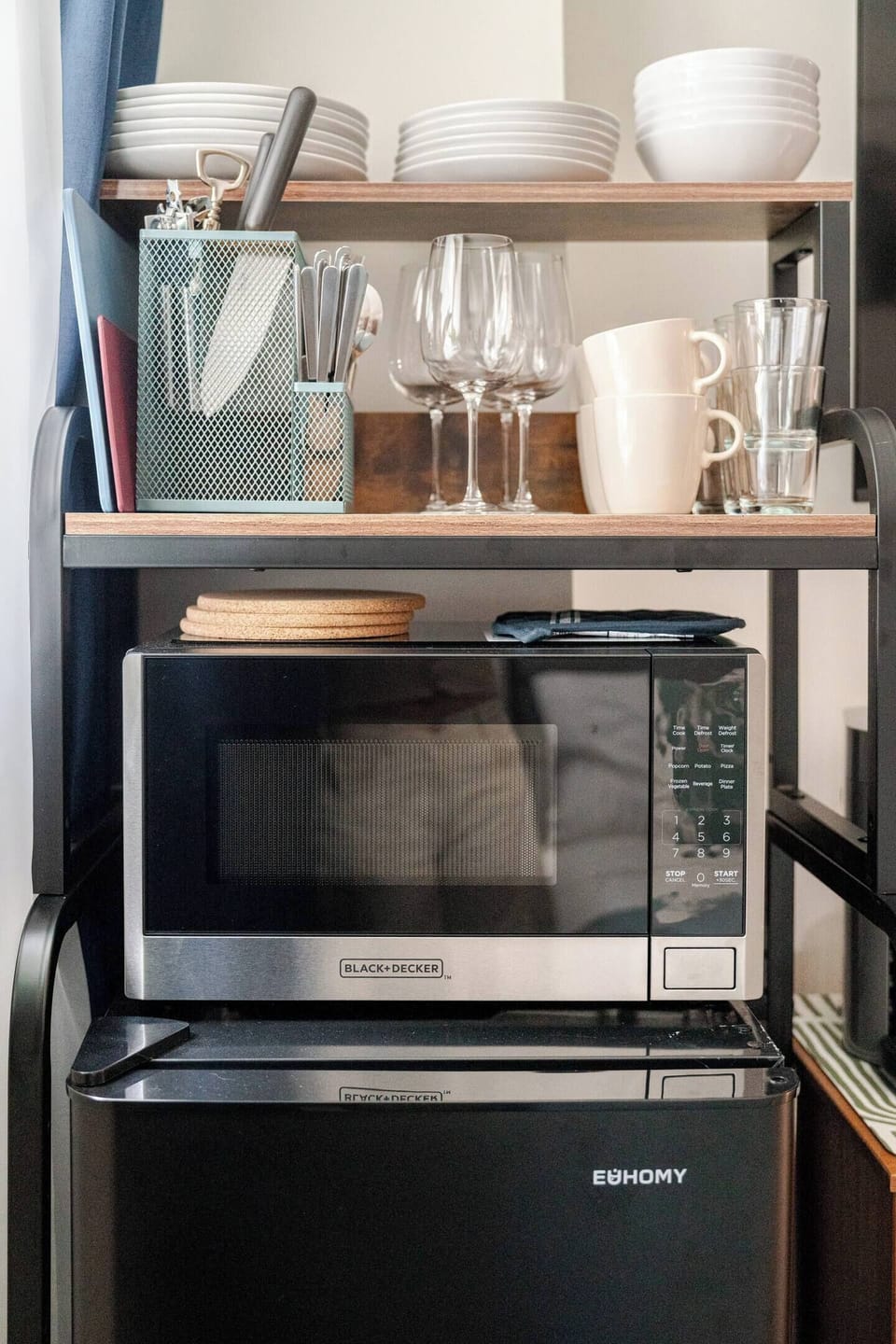 Mini fridge, freezer, microwave, basic cutlery, plates, bowls, cups, mugs